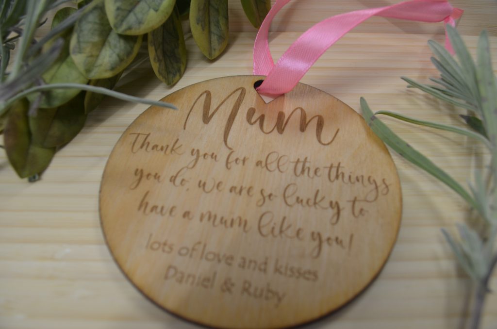 Engraved round wooden plaque